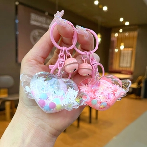 Cute luminous heart wings liquid quicksand keychains with bells and pink hardware