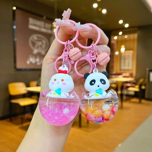 Cute bunny and panda liquid keychains with pink bells and floating sequins in eggshell spheres