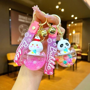 Cute cartoon rabbit and panda liquid-style keychain charms with pink sequins and bells