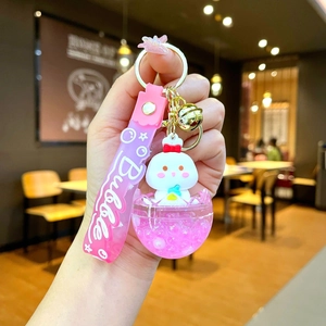 Pink bunny liquid sand keychain with silicone strap and bell for bag accessory