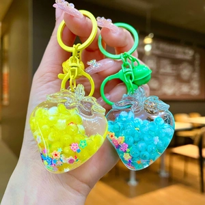 Luminous strawberry liquid oil keychain with colorful beads and charms for schoolbags