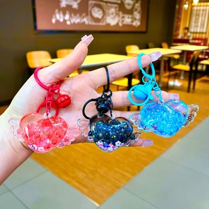 Luminous heart-shaped drifting bottle keychains with wings and liquid quicksand in 3 colors