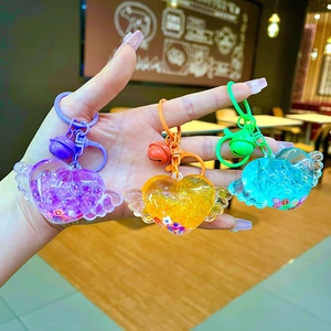 Acrylic luminous heart bottle keychain with angel wings and colorful sequins