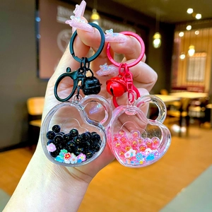 Creative heart-shaped oil-filled keychain with colorful beads and flowing sequins