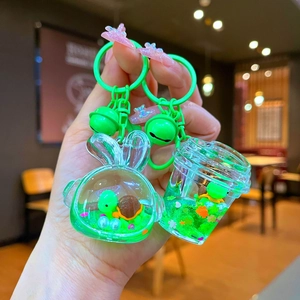 Cute green sea turtle liquid glitter keychain with bunny and cup shaped containers