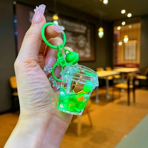Cute green turtle acrylic liquid quicksand keychain with stars and orange flowers
