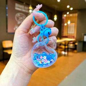 Cute heart-shaped liquid quicksand keychain with blue glitter and bell for bags