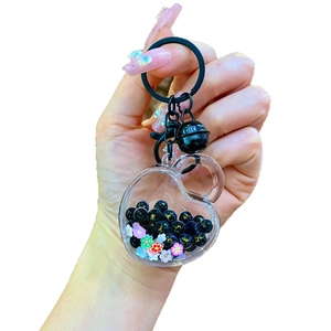 Creative heart shaped liquid quicksand keychain with black beads and flower sequins