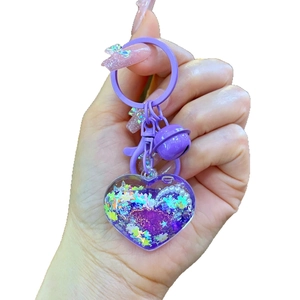 Purple heart-shaped liquid quicksand keychain with stars and pearls for girls