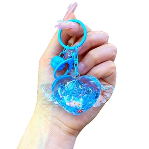 Blue heart winged keychain with liquid sand, blue bell and beads for bags and gifts
