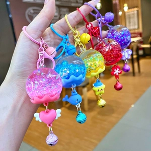 Porte-clés bouteille de sable mouvant lumineux avec paillettes et cloches colorées