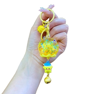 Porte-clés mignon avec bouteille flottante jaune, boule pailletée et charm étoile