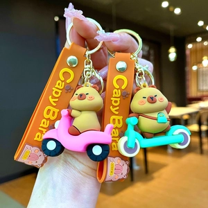 Cartoon Capybara silicone keychain with colorful scooter and motorcycle charms