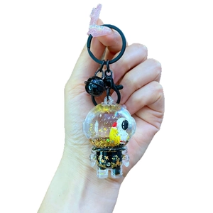 Creative astronaut floating liquid quicksand keychain with gold sequins and black bell