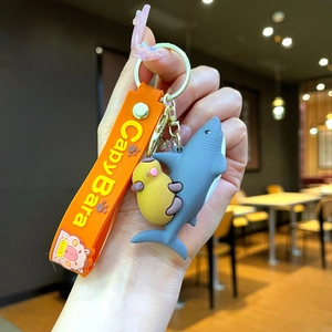 Cute Capybara and blue shark silicone keychain with orange wristlet strap and luck charm