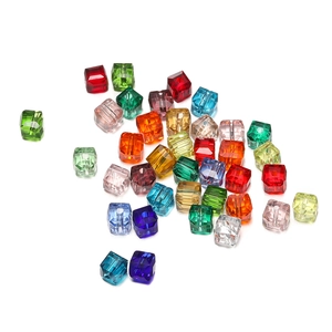 Macro detail of 8mm faceted crystal cube beads showing vibrant colors and precise cuts