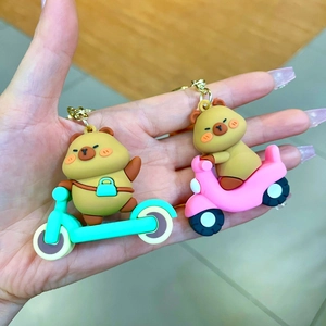 Cute silicone Capybara keychains featuring characters on mini scooters and motorbikes