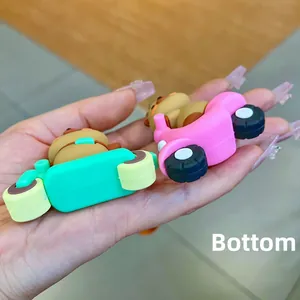 Close-up of the bottom base of cute bear scooter charms in green and pink colors