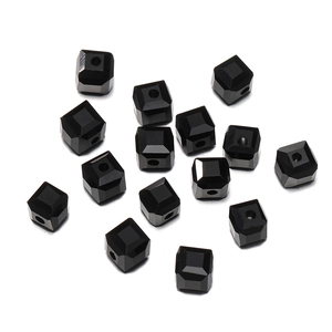 Macro shot of 8mm black faceted crystal cube beads with precision holes for DIY jewelry