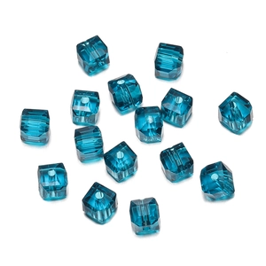Macro view of 8mm faceted dark blue crystal cube beads with polished finish for DIY jewelry