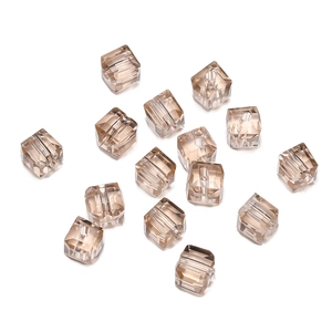 Detailed view of 8mm champagne faceted crystal cube beads with precision cut and drill holes