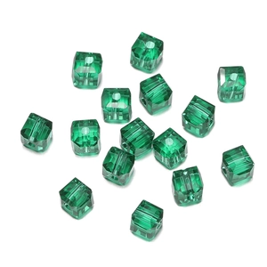 Macro detail of 8mm emerald green multi-faceted crystal square beads for DIY jewelry
