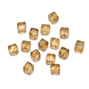 Macro view of 8mm faceted amber crystal cube beads for DIY jewelry making