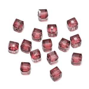 Macro shot of 8mm faceted wine red square crystal glass beads with precision cut edges