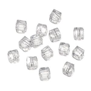 Macro shot of 8mm faceted transparent crystal cube beads with precision cut for DIY jewelry