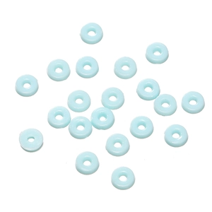 Macro view of light blue resin ring beads with smooth finish for DIY jewelry crafts