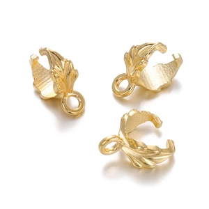 Detailed view of three polished gold leaf pendants with closed loops for DIY jewelry making