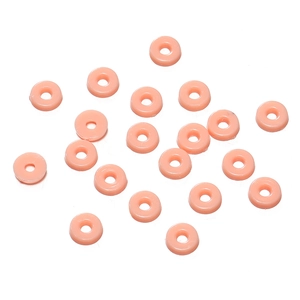 Close-up of pink doughnut-shaped resin beads for DIY jewelry making and crafts