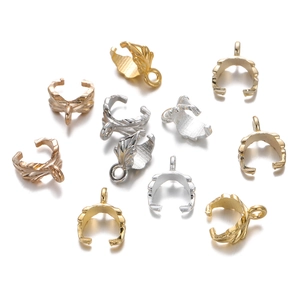 Detailed view of alloy leaf pinch bails for jewelry making in various metal finishes