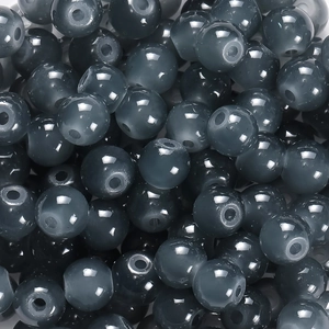 Vue macro de perles en verre translucide gris foncé pour bijoux DIY avec trous centraux
