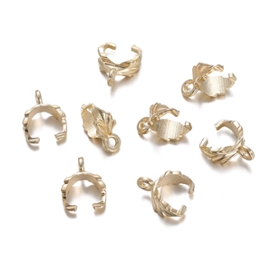 Detailed close-up of golden leaf-shaped bail clasps for DIY jewelry making