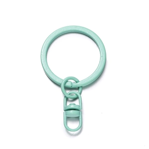 Detail of mint green lacquered metal keyring with swivel lobster clasp for DIY projects