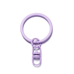 Close-up of a purple painted metal swivel lobster clasp with matching keyring for DIY crafts