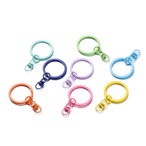 Flat lay of colorful macaron-colored keychain rings and lobster clasps for DIY crafts