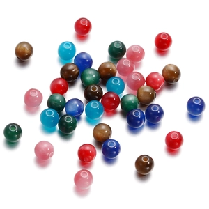 Close-up of colorful round 6/8mm resin cat eye beads with 1.5mm holes for DIY jewelry