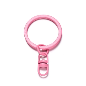 Macro shot of candy pink lacquered metal keychain with 360-degree rotating lobster clasp