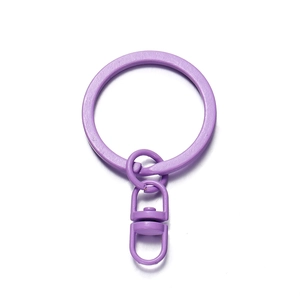 Macro shot of light purple keychain set including split ring and swivel snap hook fastener