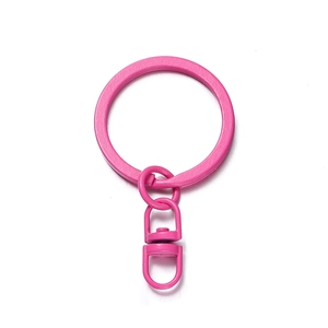 Detail of pink matte lacquer key ring set featuring a 360-degree swivel lobster clasp