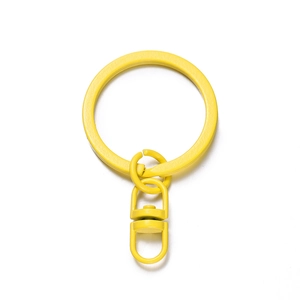 Close-up of bright yellow lacquered metal keychain with a 360-degree rotating swivel clasp