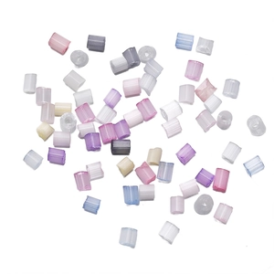 Macro detail of 2/3mm colorful faceted glass seed beads for DIY jewelry making