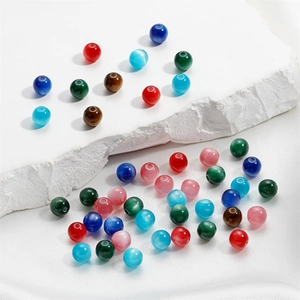 Macro detail of colorful 6/8mm resin cat eye beads for DIY necklace and jewelry making