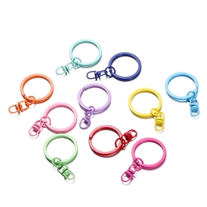 Macro view of colorful matte paint metal keychains in various candy colors on white