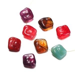 Macro view of assorted colorful irregular acrylic beads for DIY jewelry and phone chains