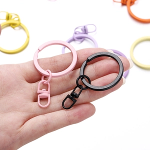 Close-up of colorful lacquered metal keyrings with swivel lobster clasps for DIY crafts