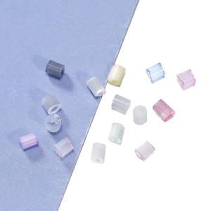 Macro shot of colorful semi-transparent cylinder beads for DIY jewelry making and crafts