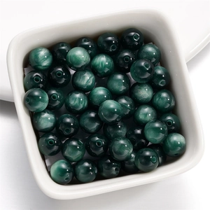 Detailed view of dark green cat eye resin beads with 1.5mm holes for DIY jewelry